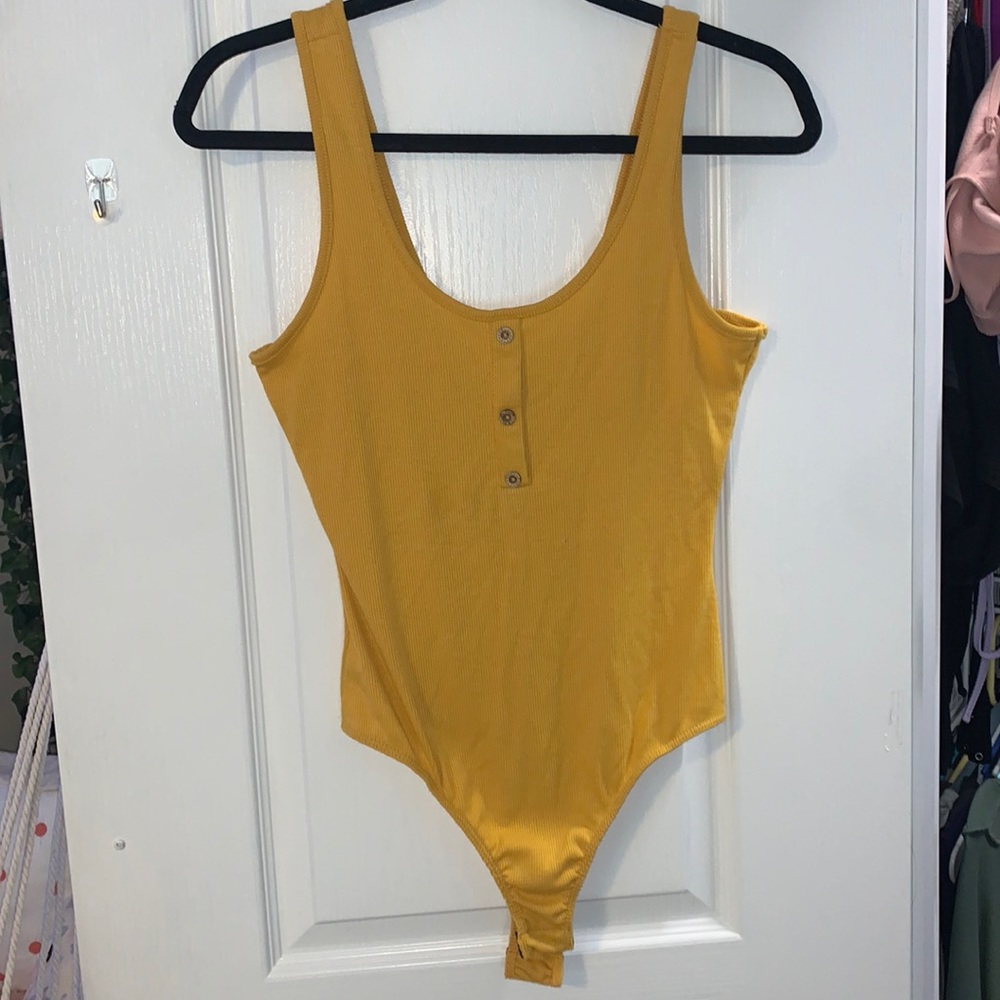 yellow tank top body suit with buttons